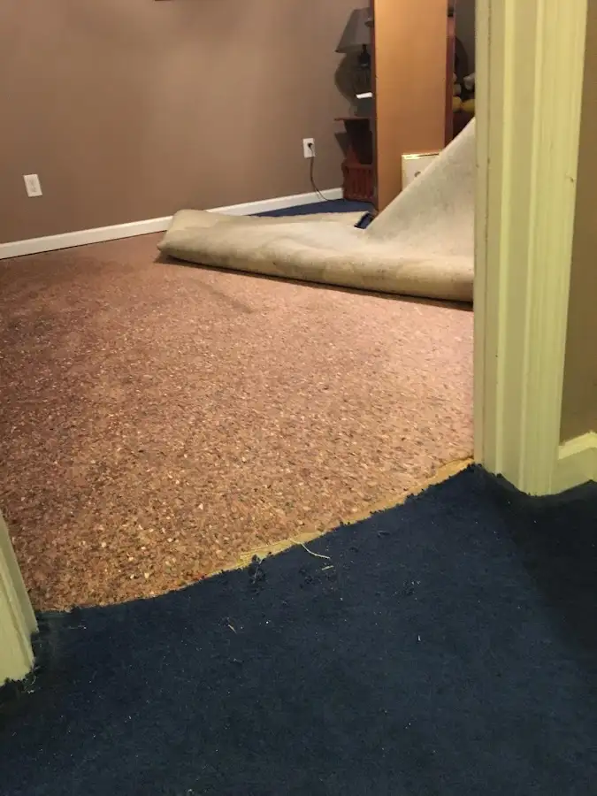 Carpet pad removal revealing water damage during Drying & Dehumidification in Ramona